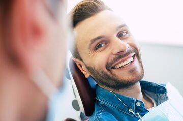 Man smiling in dentist chair