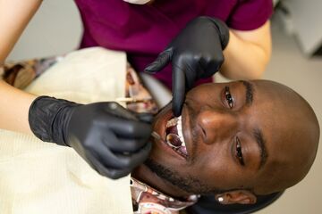Man having teeth checked at dentist